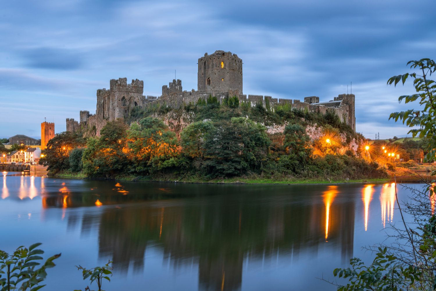 Pembroke, Wales, United Kingdom - September 22, 2016: Panoramic view of Pembroke Castle in South Wales at night